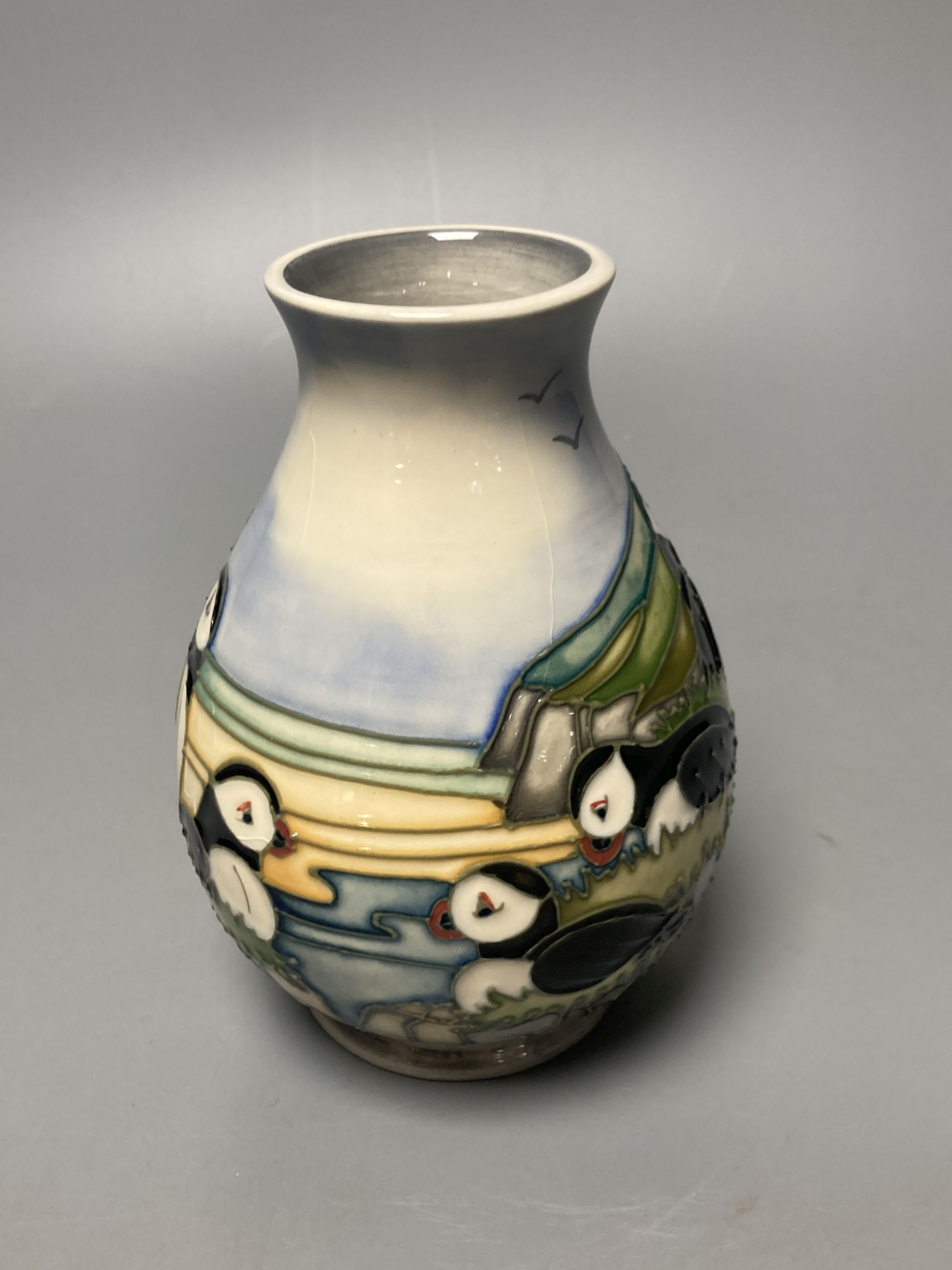 A Moorcroft puffin pattern vase, decorated by Kerri, height 14cm, boxed